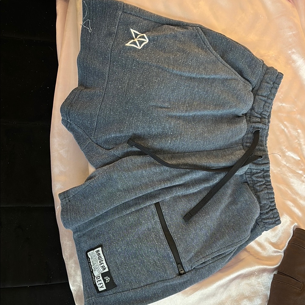 Blue athletic shorts with elastic waistband and soft material